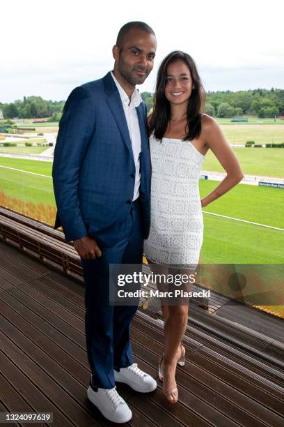 Tony Parker and Alize Lim attend the 'Tony Parker Infinity Nine Horses' press conference at Hippodrome de Longchamp on June 17, 2021 in Paris,...