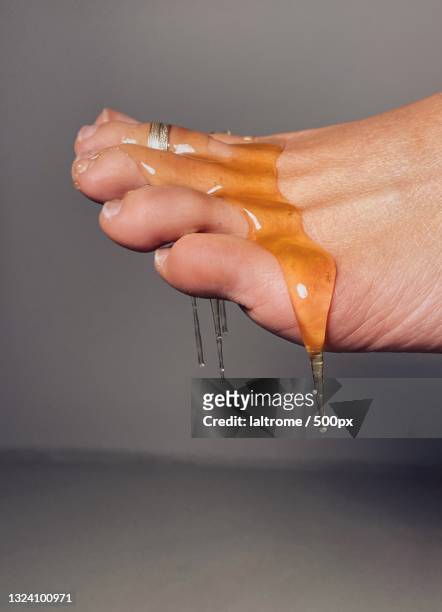cropped foot with honey dripping off it,padova,italy - kinky stock-fotos und bilder