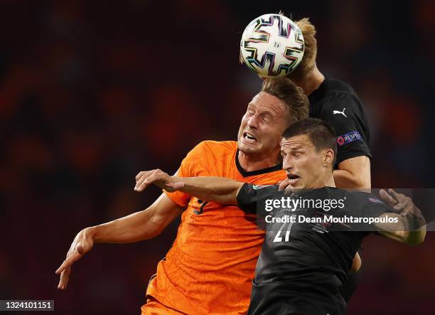 Luuk de Jong of Netherlands competes for a header with Sasa Kalajdzic and Stefan Lainer of Austria during the UEFA Euro 2020 Championship Group C...