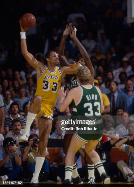 Los Angeles Lakers Kareem Abdul Jabbar takes a shot over Boston Celtics Larry Bird during 1985 NBA Finals between Los Angeles Lakers and Boston...