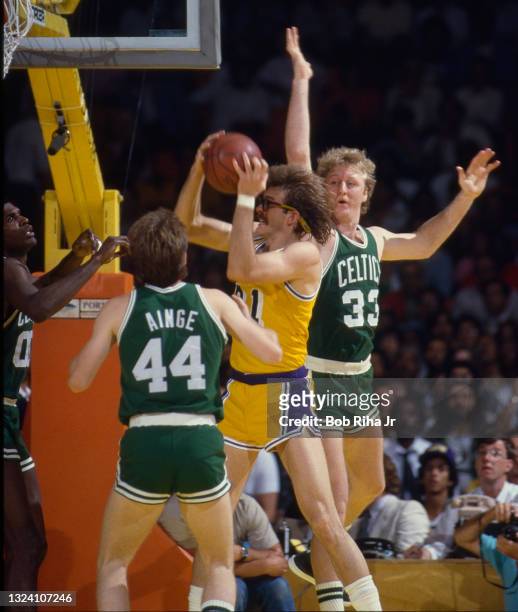 Los Angeles Lakers Kurt Rambis gets rebound over Boston Celtics Larry Bird and Danny Ainge during 1985 NBA Finals between Los Angeles Lakers and...