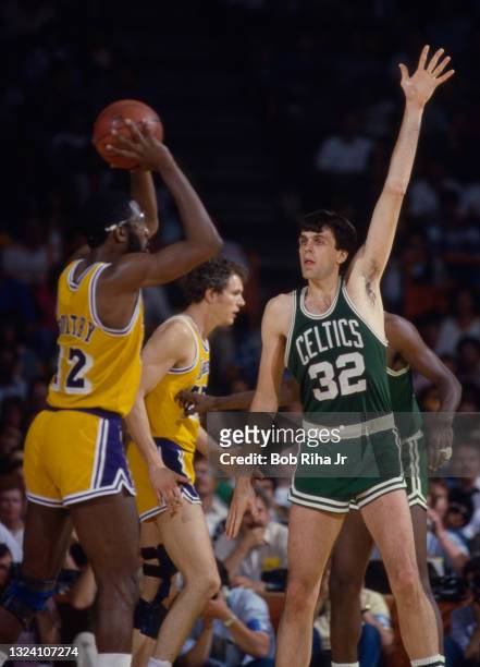 Los Angeles Lakers James Worthy looks for open player over Boston Celtics Kevin McHale during 1985 NBA Finals between Los Angeles Lakers and Boston...