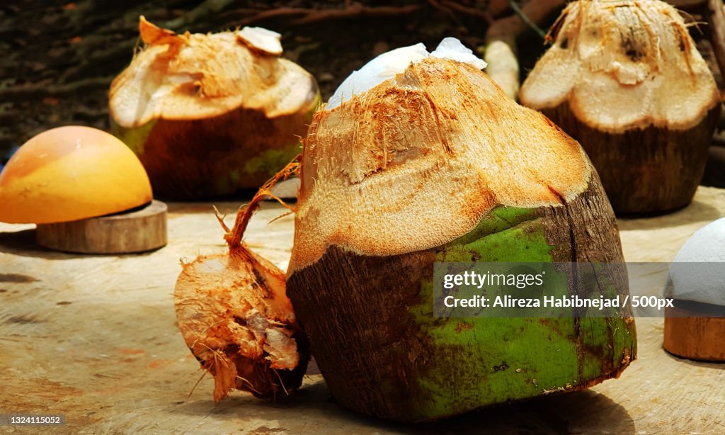 Close-up of coconuts on table