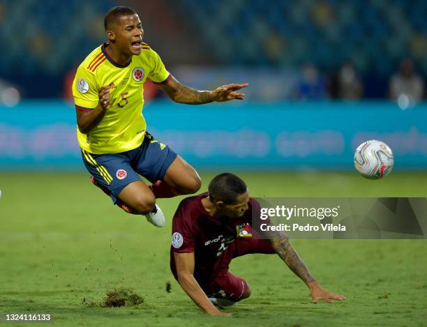 Wilmar Barrios of Colombia falls down against Yohan Cumana of Venezuela during a Group B match between Colombia and Venezuela as part of Copa America...