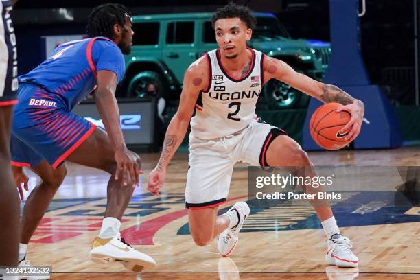 James Bouknight of the Connecticut Huskies dribbles the ball against the DePaul Blue Demons during a Big East Tournament quarterfinal game at Madison...