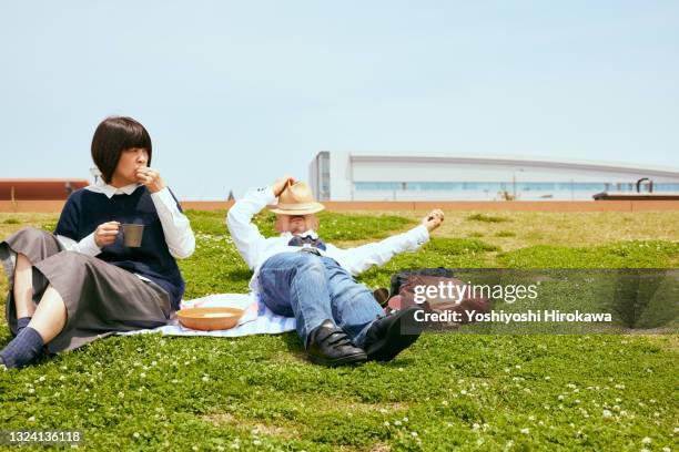 seniors having lunch on the lawn - tokyo food stock pictures, royalty-free photos & images