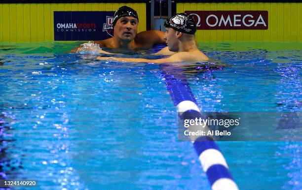 Ryan Lochte and Chase Kalisz of the United States react after competing in a semifinal heat for the Men's 200m individual medley during Day Five of...