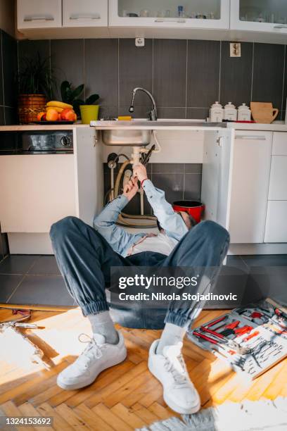 plumber - under sink stock pictures, royalty-free photos & images