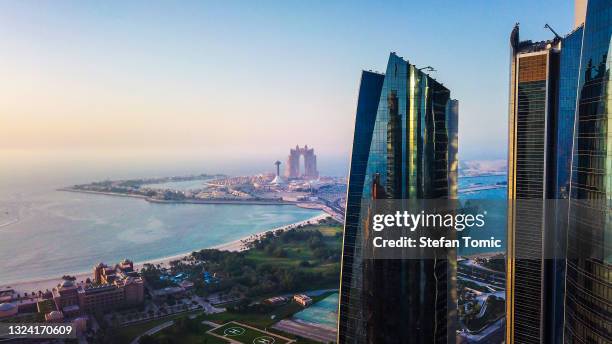 marina island and emirates palace in abu dhabi top view with the city downtown in the uae capital - abu dhabi business stock pictures, royalty-free photos & images