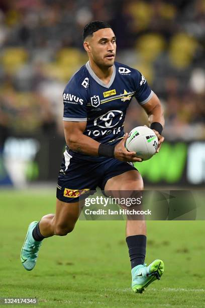 Valentine Holmes of the Cowboys runs the ball during the round 15 NRL match between the North Queensland Cowboys and the Cronulla Sharks at QCB...