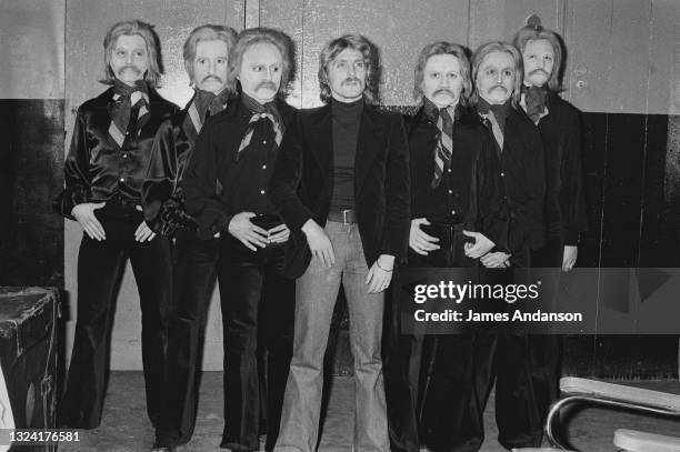 French singer and songwriter Christophe surrounded by look-alike's during his show at the Olympia music hall, directed by composer Jean-Michel Jarre.