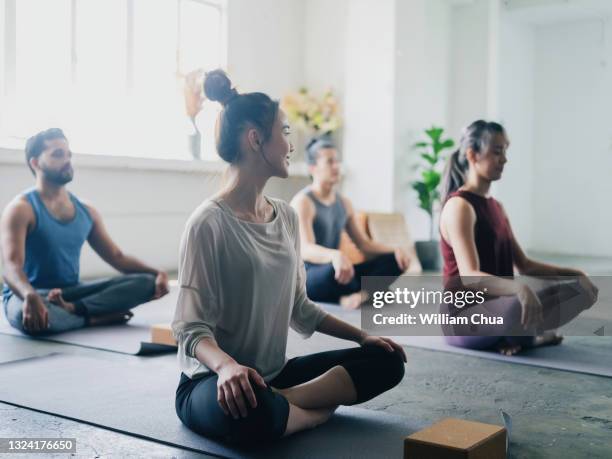 group of people yoga and heathy living together - yoga studio stock pictures, royalty-free photos & images