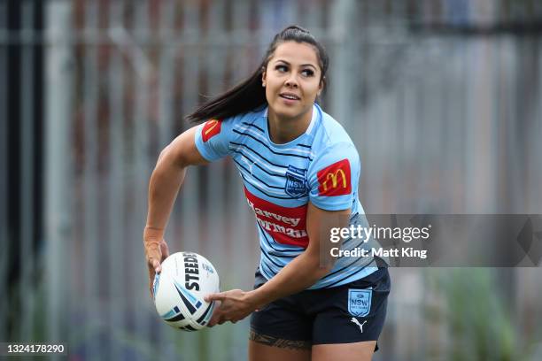 Tiana Penitani passes during the New South Wales State of Origin media opportunity at NSWRL Centre of Excellence, on June 18, 2021 in Sydney,...