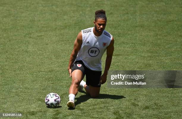 Tyler Roberts of Wales stretches during a training session at ahead of the UEFA Euro 2020 Championship at Tofiq Bahramov Stadium on June 18, 2021 in...