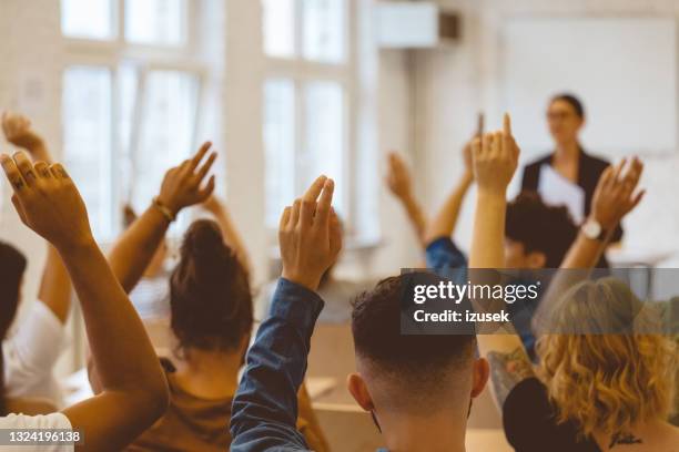 Key Raising Hand 746 College Classroom Raising Hand Stock Photos, High-Res Pictures, and ...