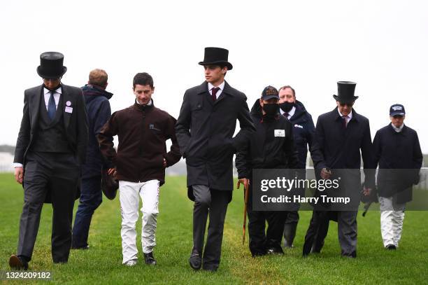 Trainer Joseph O'Brien, Jockey Oisin Murphy, Trainer Donnacha O'Brien, Trainer Aidan O'Brien and Jockey Ryan Moore look on on Day Four of the Royal...