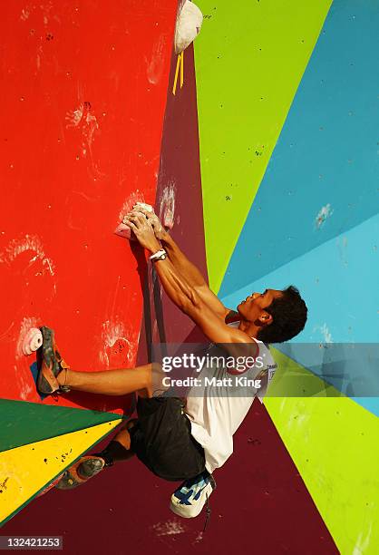 Rachmad Afmi Topa of Indonesia competes in the Mens Sport Climbing on day two of the 2011 Southeast Asian Games at Jakabaring Sports Complex on...