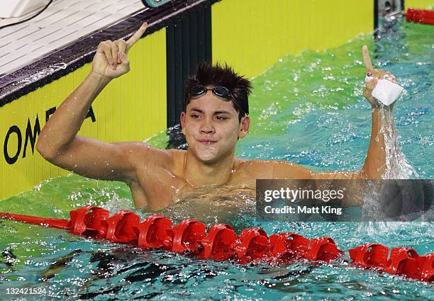 Joseph Schooling of Singapore celebrates winning the Mens 50m Butterfly Final on day two of the 2011 Southeast Asian Games at Jakabaring Sports...