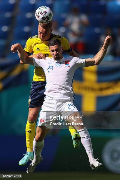 Ludwig Augustinsson of Sweden wins a header whilst under pressure from Martin Koscelnik of Slovakia during the UEFA Euro 2020 Championship Group E...