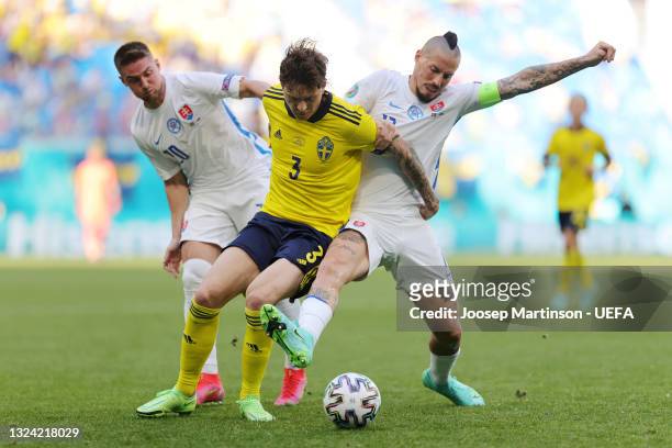 Victor Lindeloef of Sweden is challenged by Robert Mak and Marek Hamsik of Slovakia during the UEFA Euro 2020 Championship Group E match between...
