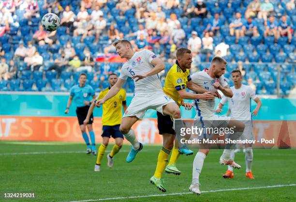 Tomas Hubocan of Slovakia heads the ball away whilst under pressure from Sebastian Larsson of Sweden during the UEFA Euro 2020 Championship Group E...