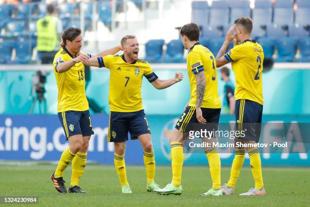 Sebastian Larsson and Gustav Svensson of Sweden celebrate with team mates after victory in the UEFA Euro 2020 Championship Group E match between...