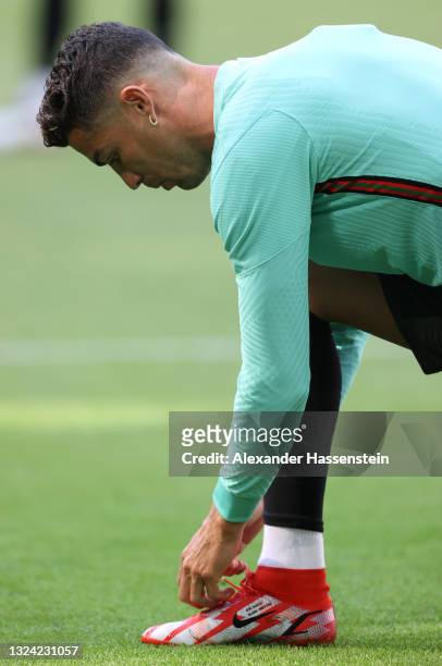 Cristiano Ronaldo of Portugal ties his shoe laces during the Portugal Training Session ahead of the UEFA Euro 2020 Group F match between Portugal and...