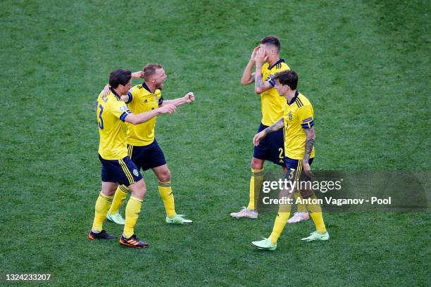 Sebastian Larsson and Gustav Svensson of Sweden celebrate with team mates after victory in the UEFA Euro 2020 Championship Group E match between...