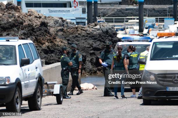 Several Guardia Civil officers in the area where the fourth body has been located , of the inflatable boat that sank last night, in the port of...