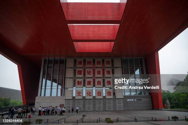 The press interviews some students and professors at CELAP and some slogans are seen on the wall of the academy on June 18, 2021 in Shanghai, China....