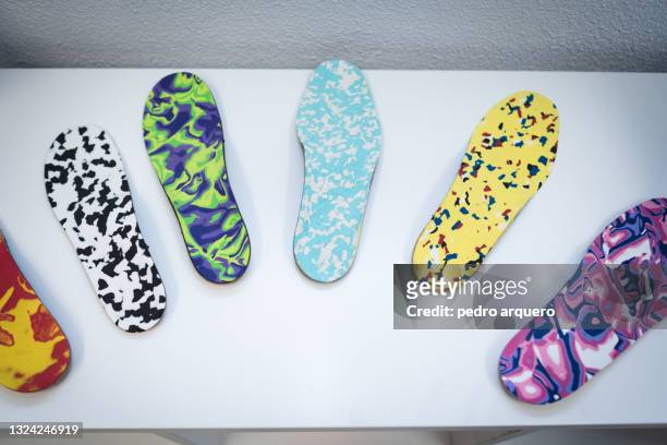 orthopedic insoles of various colors - natural arch stock pictures, royalty-free photos & images