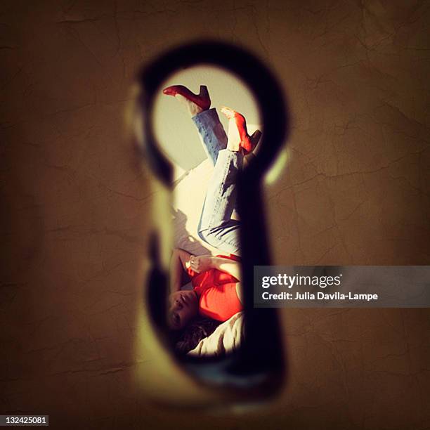 beautiful woman through keyhole - lech stock pictures, royalty-free photos & images
