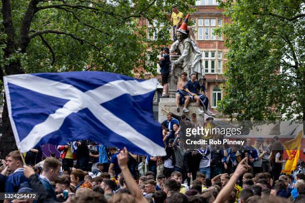 Scotland fans climb a statue of William Shakespeare in Leicester Square on June 18, 2021 in London, England. England v Scotland is not only the...