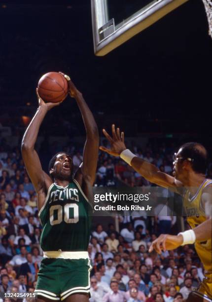 Boston Celtics Robert Parish takes a shot over Los Angeles Lakers Kareem Abdul-Jabbar during 1985 NBA Finals between Los Angeles Lakers and Boston...