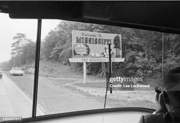 View, through the front windshield of a Freedom Rider bus, of a 'Welcome to Mississippi' billboard, Alabama, May 24, 1961.