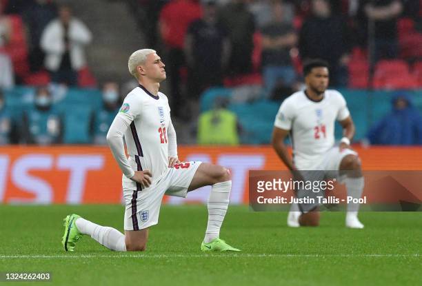 Phil Foden of England takes a knee in support of the Black Lives Matter movement prior to the UEFA Euro 2020 Championship Group D match between...