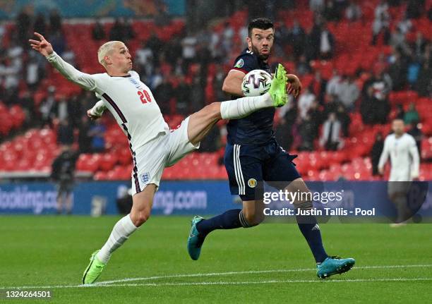 Phil Foden of England controls the ball whilst under pressure from Grant Hanley of Scotland during the UEFA Euro 2020 Championship Group D match...