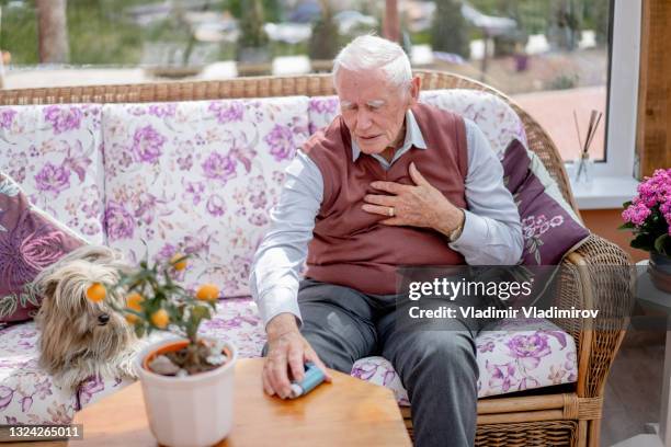 emergency situation of a senior man having asthma attack - breath vapor stock pictures, royalty-free photos & images