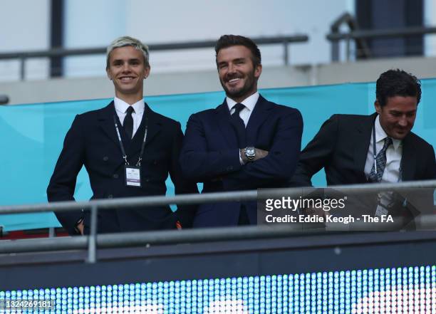Romeo Beckham and David Beckham, Former England International react as they watch on from the stands during the UEFA Euro 2020 Championship Group D...