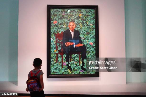 Visitors view the official portrait of former president Barack Obama by Kehinde Wiley at The Art Institute of Chicago on June 18, 2021 in Chicago,...