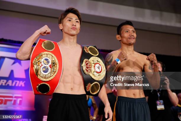 Bantamweight champion Naoya Inoue of Japan poses with Michael Dasmarinas of Philippines during an official weigh-in at Virgin Hotels Las Vegas on...