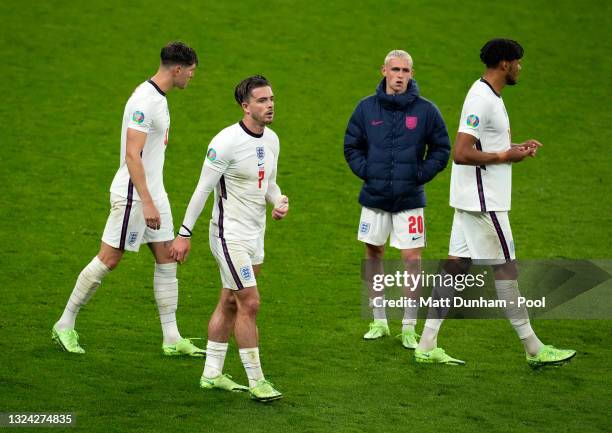 Jack Grealish of England looks dejected with team mates John Stones, Phil Foden and Tyrone Mings following the UEFA Euro 2020 Championship Group D...