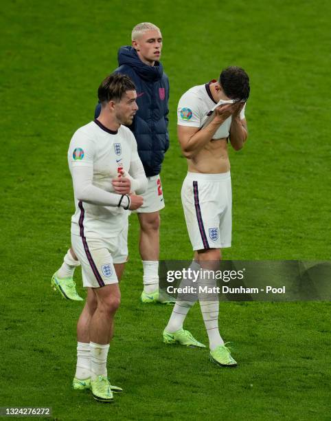 Jack Grealish, Phil Foden and John Stones of England look dejected after the UEFA Euro 2020 Championship Group D match between England and Scotland...