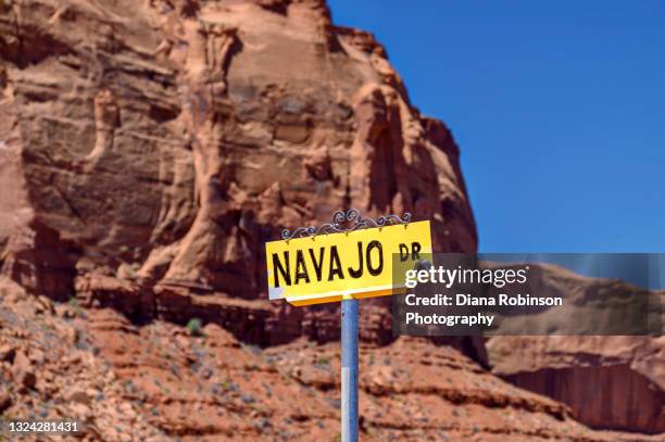 navajo drive sign near gouldings trading post in monument valley, arizona - trading post stock pictures, royalty-free photos & images