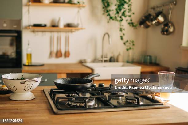 interior of kitchen and desk and leaves - wood table top stock-fotos und bilder