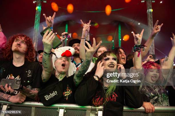 Music fans enjoy live perofrmances during Download Festival at Donington Park on June 18, 2021 in Donington, England. Download Pilot is a 10,000...