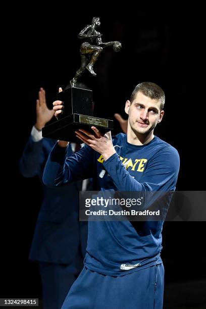 Nikola Jokic of the Denver Nuggets accepts the 2021 NBA MVP award before Game Three of the Western Conference second-round playoff series at Ball...