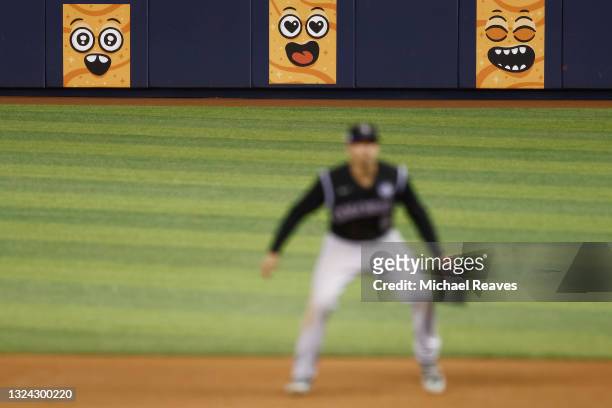 Cinnamon Toast Crunch "Cinnamoji" are seen on the outfield wall during play between the Miami Marlins and the Colorado Rockies at loanDepot park on...