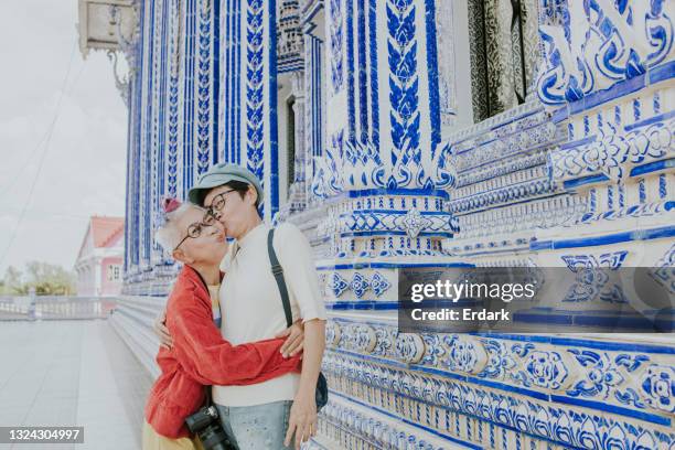 senior woman kiss her hipster her best friend with happiness-stock photo - asian lesbians kiss stock pictures, royalty-free photos & images