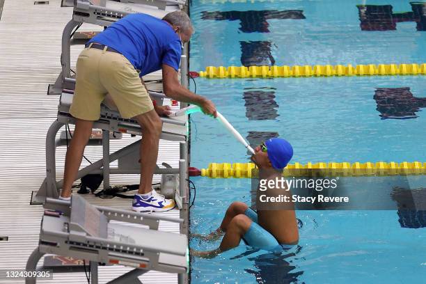 Abbas Karimi of the Refugee Para Team competes in the Men's 50m Backstroke final during day 2 of the 2021 U.S. Paralympic Swimming Trials at the Jean...